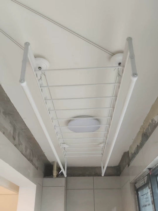 Hand winch clothes drying rack installed on a balcony ceiling, suitable for indoor or outdoor use.