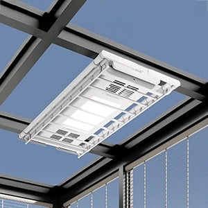 EaseRack Pro clothes drying rack installed in sunroom ceiling, ensuring full sun exposure for faster drying.