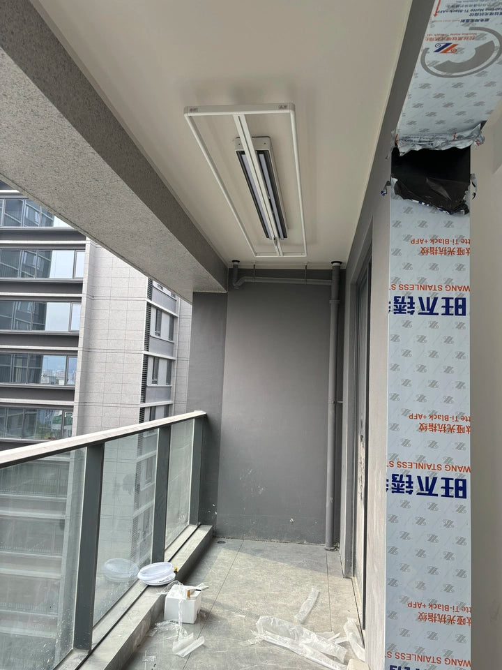 EaseRack X9 Mini mounted on a covered outdoor balcony ceiling, suitable for modern high-rise living.