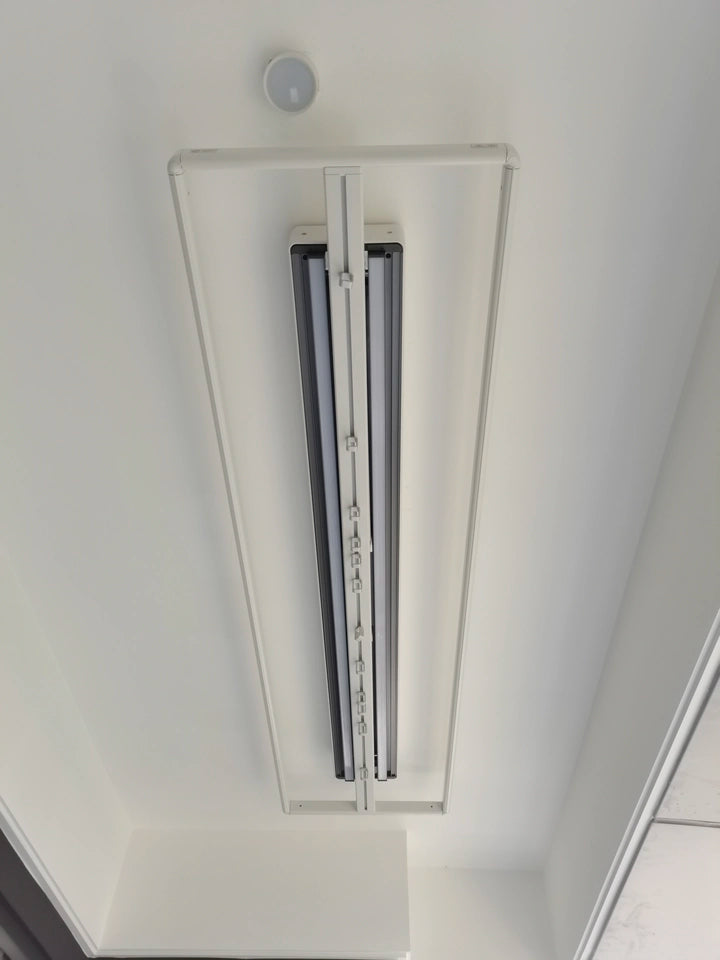 EaseRack X9 Mini electric drying rack installed on a flat plasterboard ceiling for modern indoor use.