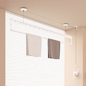 Bedroom ceiling clothes airer for indoor laundry drying with manual crank system.