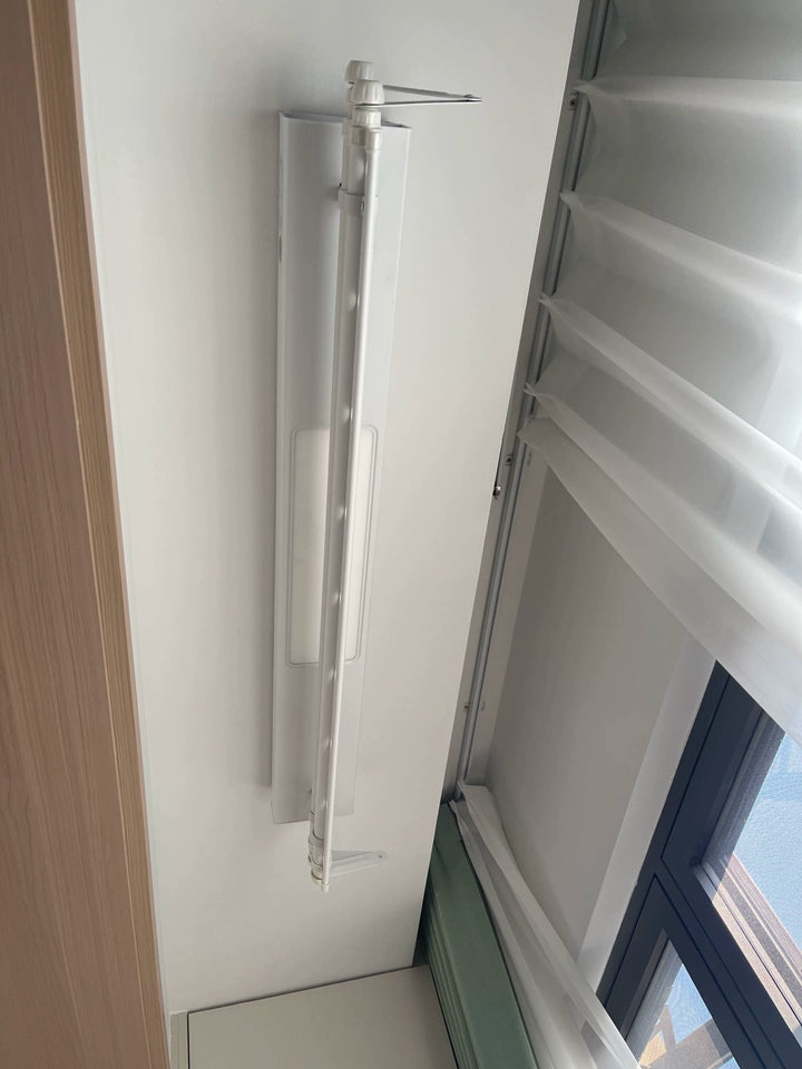 Easerack M2 Mini Clothes Airer installed in small laundry room, efficient space utilization