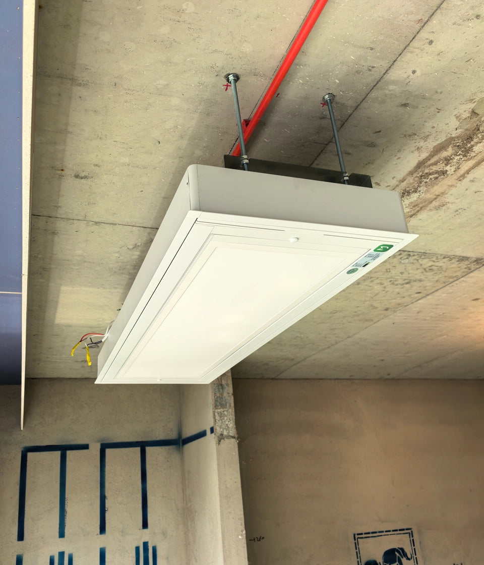 M20 built-in ceiling drying rack installed on exposed concrete ceiling