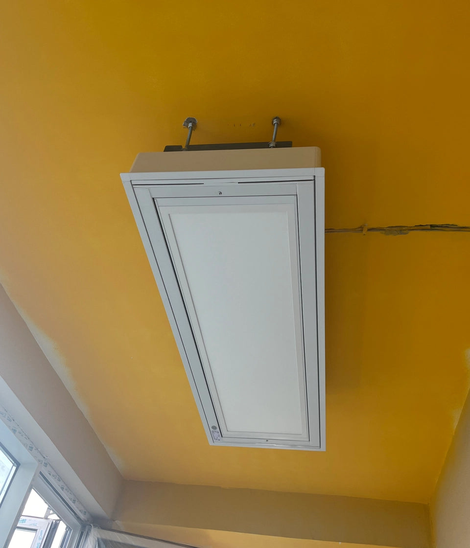 M20 built-in drying rack installed on yellow painted ceiling
