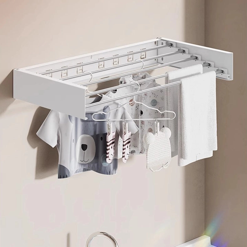 EaseRack Wall-mounted clothes drying rack installed in a balcony cabinet, ideal for small spaces