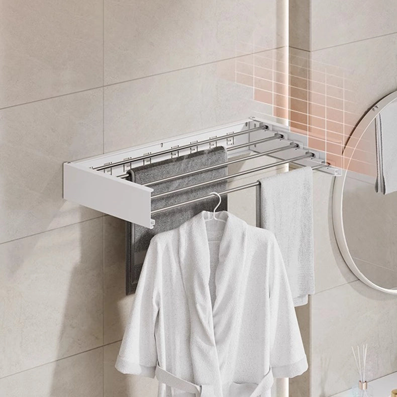 Wall-mounted clothes drying rack installed in bathroom with staggered bar design for faster drying