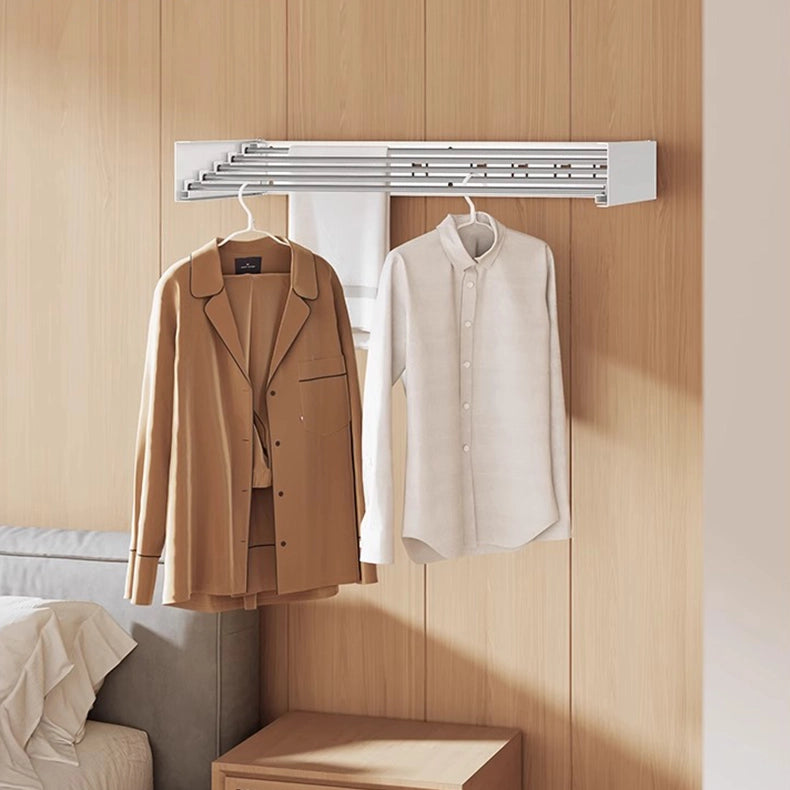 Wall-mounted folding clothes rack installed in bedroom, perfect for storing worn clothes