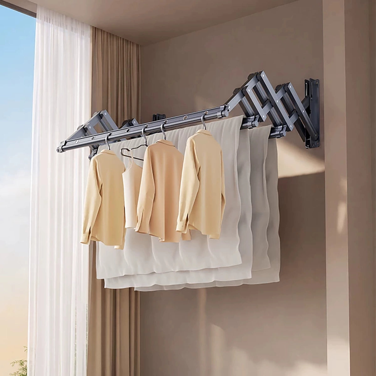 EaseRack wall-mounted retractable drying rack with three drying rails holding clothes and bedding in an indoor laundry space.
