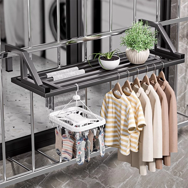 Multifunctional clothes drying rack hanging securely on a window security grille, suitable for city apartments.