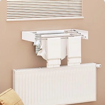 EaseRack Wall mounted folding clothes drying rack installed above radiator for space-saving indoor drying.