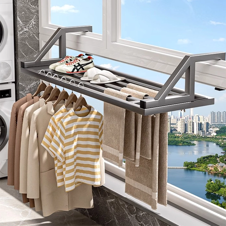 Wide multi-bar drying rack installed on a window frame, holding shoes, clothes, towels, and quilts. Expands drying area efficiently.