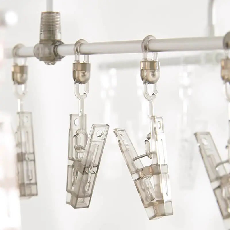 Hanging clip rack with six transparent clips for small laundry items