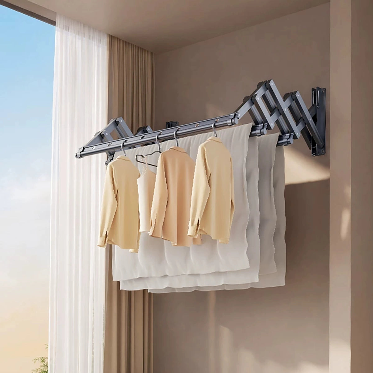 EaseRack wall-mounted retractable drying rack holding clothes and bedding in an indoor laundry area.
