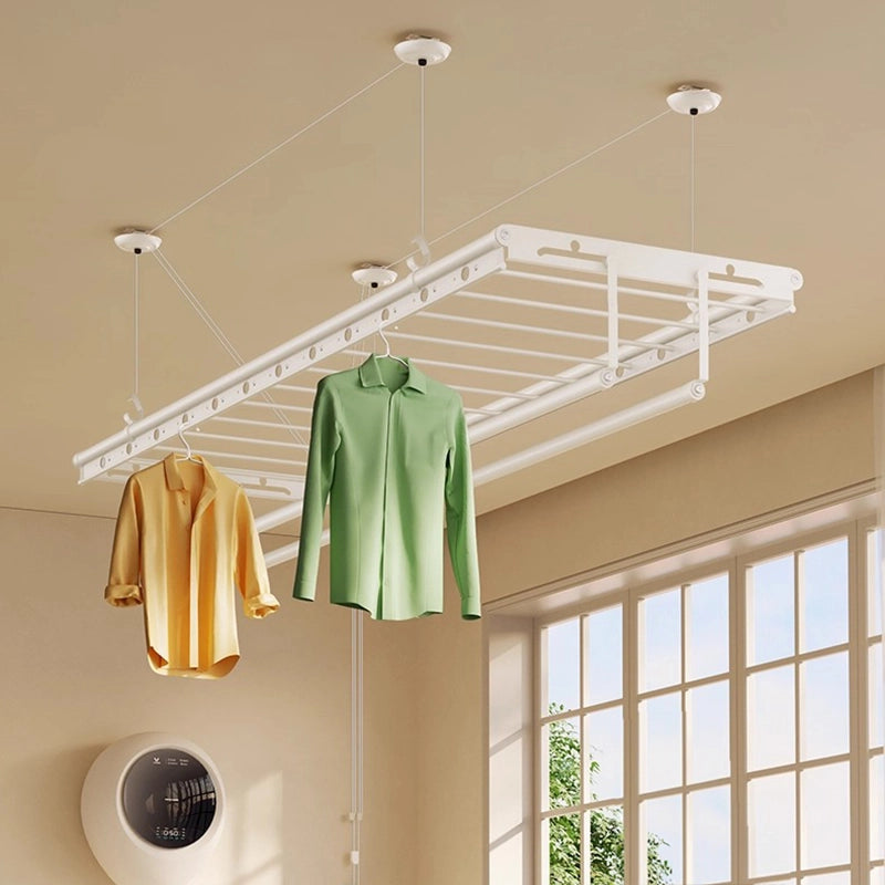 Hand-cranked ceiling clothes drying rack in a cozy balcony laundry space, with soft daylight, colorful shirts hanging.