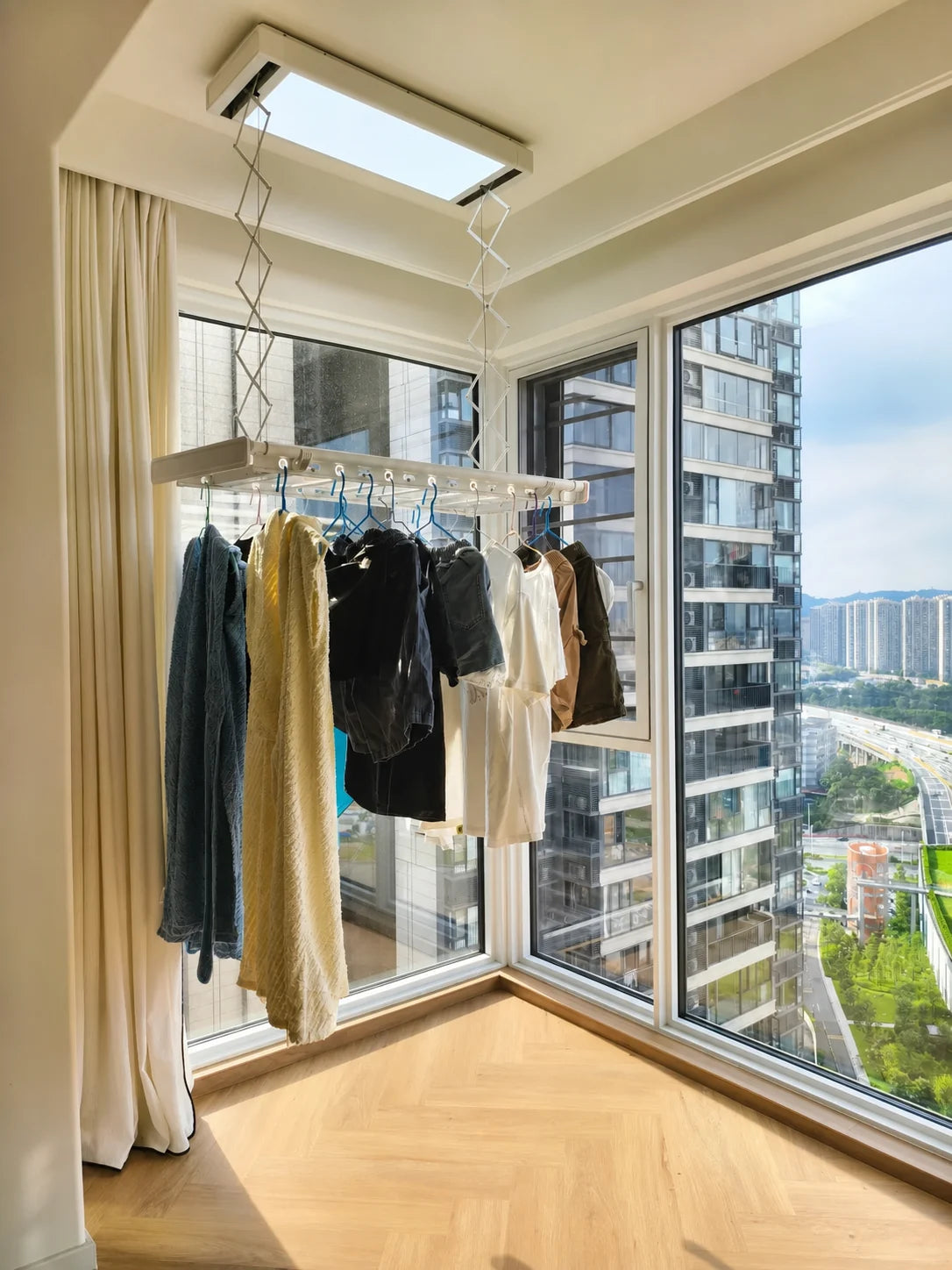 Compact 1.5 by 3.2 metre balcony laundry area with an EaseRack M3 Mini ceiling airer