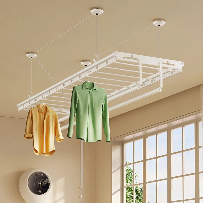 Clothes on hangers using the built-in hanger holes of the ceiling drying rack.