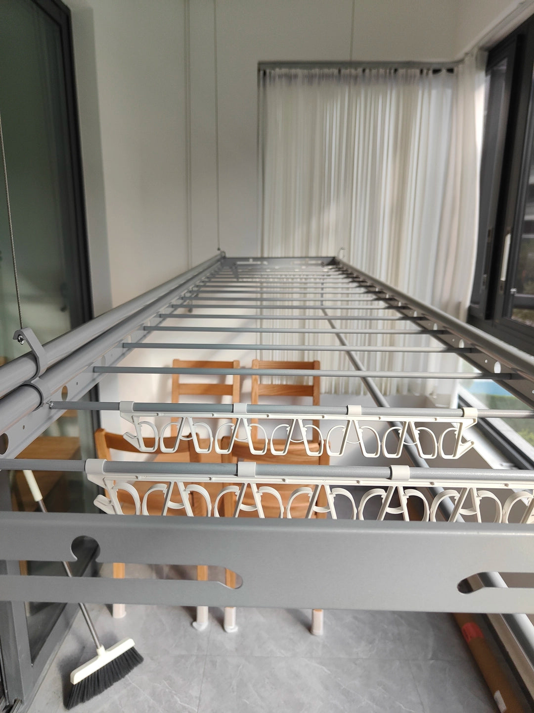 Close-up of the Extra-Wide ceiling clothes airer showing the main rods, crossbars and hanger positions