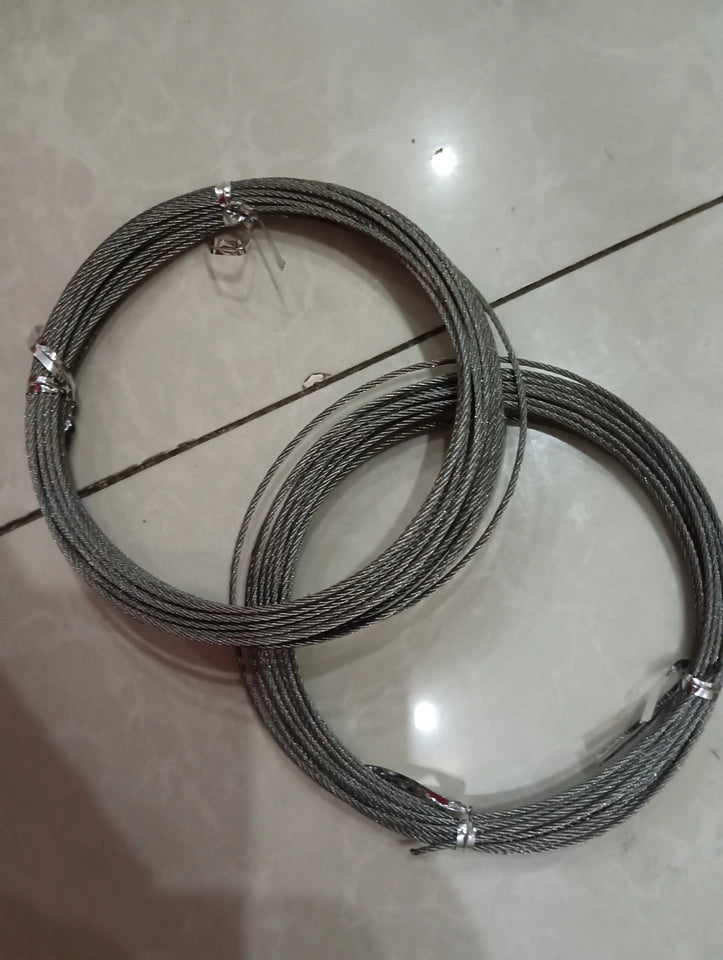 Two coils of braided steel wire rope used as replacement lifting cables for a ceiling drying rack